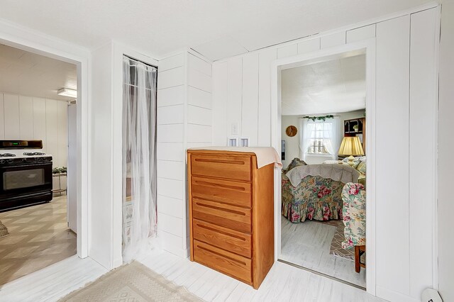 bedroom with a baseboard heating unit and a textured ceiling