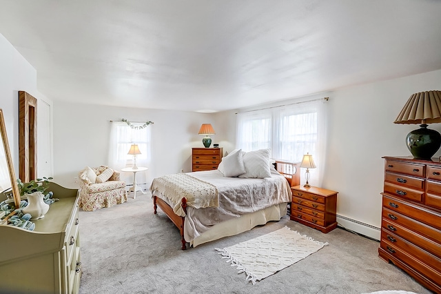 carpeted bedroom with baseboard heating