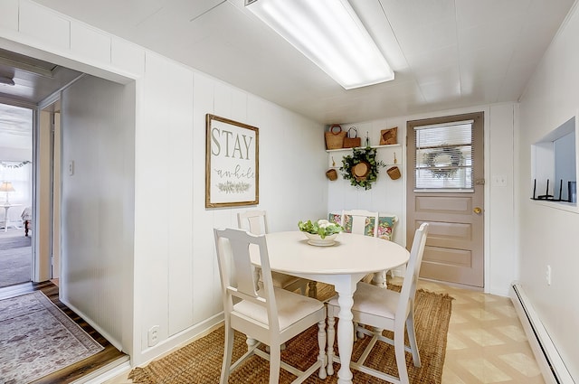 dining area with a baseboard radiator