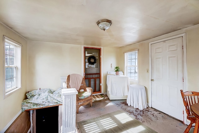 interior space featuring washer / dryer and concrete flooring