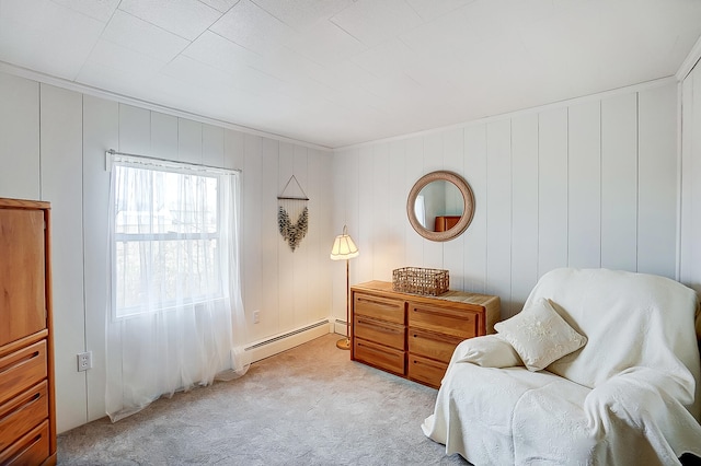 sitting room with light carpet and a baseboard radiator