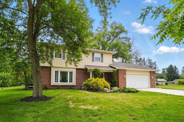 2357 London Dr, Lima, OH 45805 - view of front facade with a garage, driveway, brick siding, and a front yard