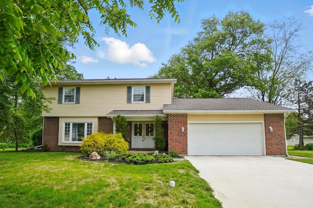 2357 London Dr, Lima, OH 45805 - view of front of property featuring french doors, brick siding, and a garage