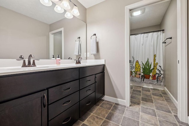 2306 Larkspur Dr, Troy, OH 45373 - full bath with double vanity and baseboards