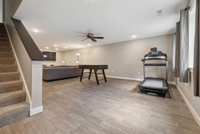 2306 Larkspur Dr, Troy, OH 45373 - exercise room featuring ceiling fan, light wood-style floors, recessed lighting, and a textured ceiling