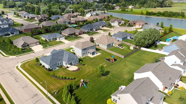 2306 Larkspur Dr, Troy, OH 45373 - aerial perspective of suburban area with a nearby body of water