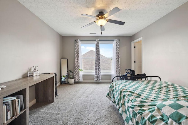 2306 Larkspur Dr, Troy, OH 45373 - carpeted bedroom featuring a textured ceiling and ceiling fan