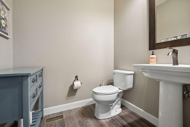 2306 Larkspur Dr, Troy, OH 45373 - bathroom with wood finished floors and toilet