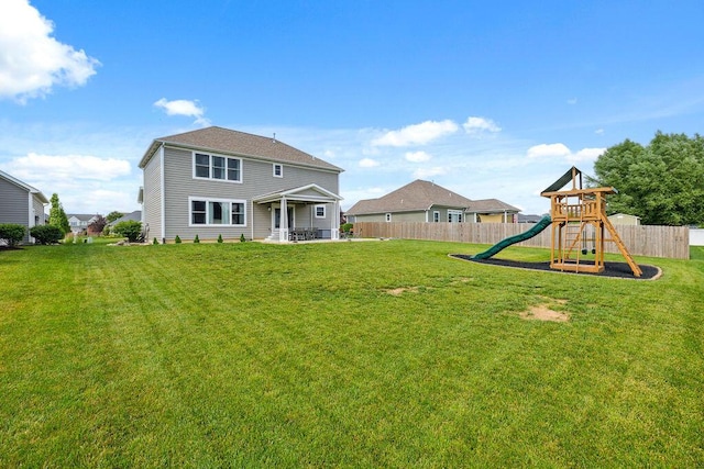2306 Larkspur Dr, Troy, OH 45373 - rear view of house featuring a playground