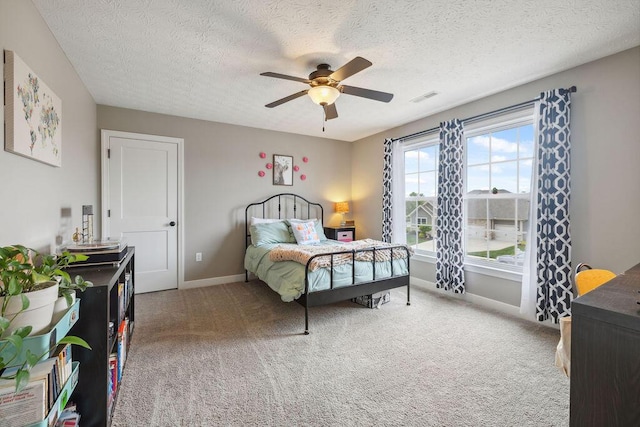2306 Larkspur Dr, Troy, OH 45373 - bedroom featuring a textured ceiling, carpet floors, and a ceiling fan