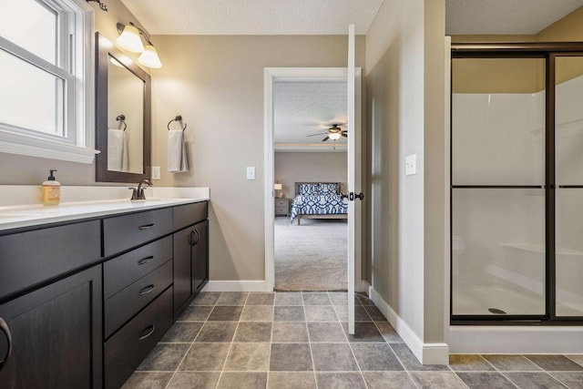 2306 Larkspur Dr, Troy, OH 45373 - full bathroom with vanity, ceiling fan, ensuite bathroom, a stall shower, and a textured ceiling