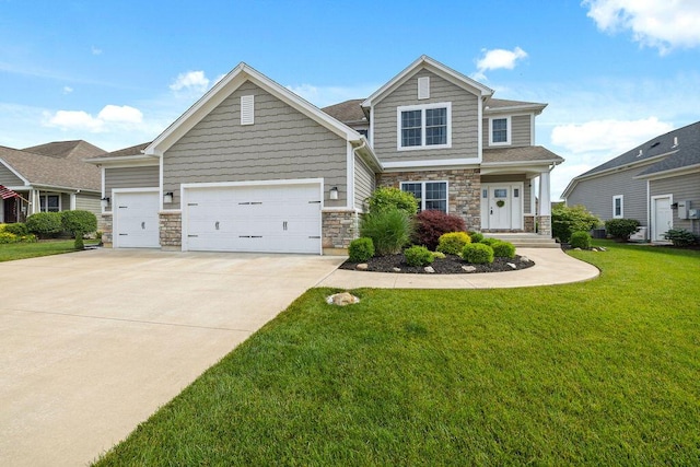 2306 Larkspur Dr, Troy, OH 45373 - craftsman-style house with driveway, a front lawn, stone siding, and an attached garage