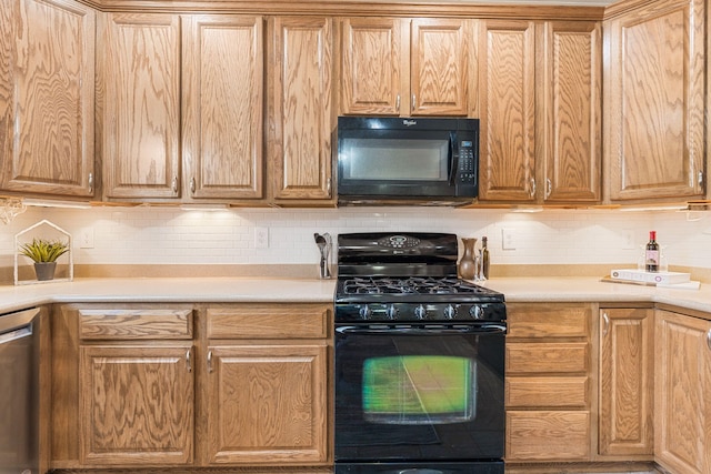 kitchen featuring tasteful backsplash, black appliances, and light countertops