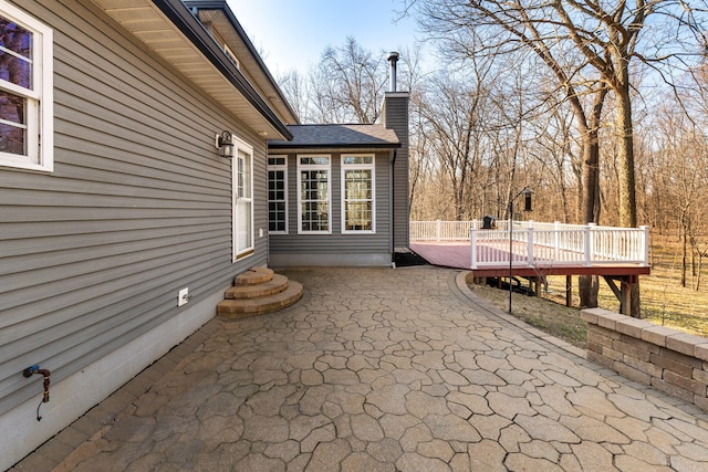 view of patio featuring entry steps and a deck