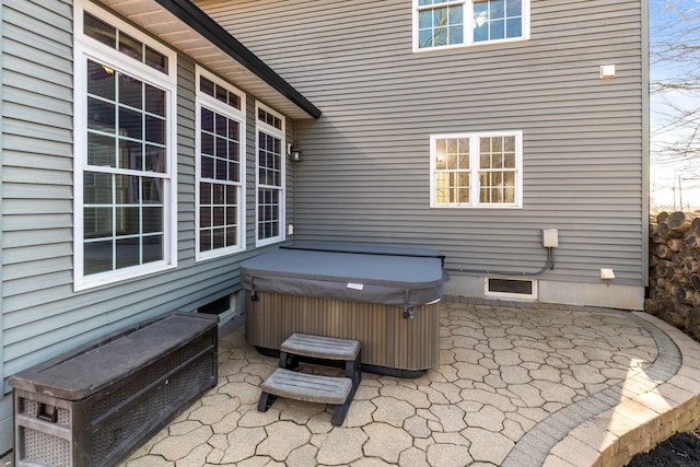 view of patio / terrace with a hot tub