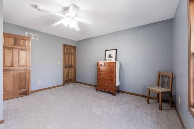 bedroom featuring visible vents, light colored carpet, baseboards, and ceiling fan