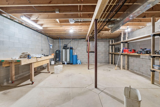 unfinished basement with a workshop area