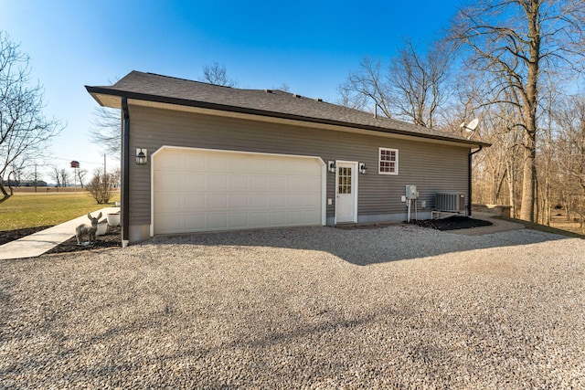 garage featuring central AC and driveway