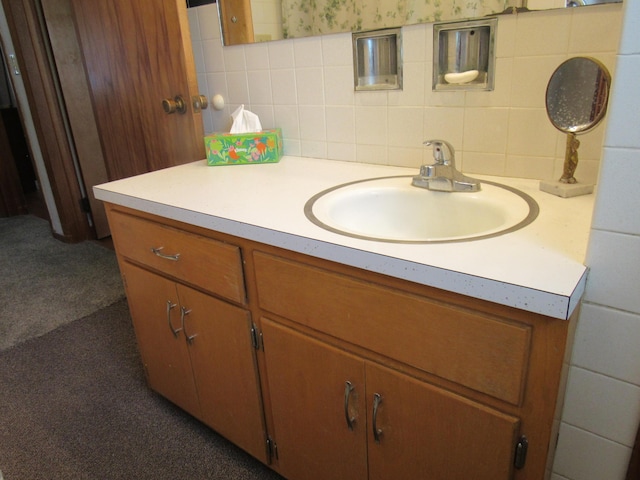 bathroom with vanity and decorative backsplash