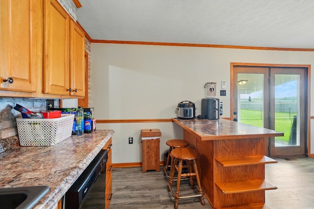 kitchen with crown molding, open shelves, a peninsula, black dishwasher, and light wood-style flooring
