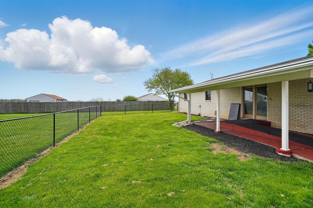 view of yard with a patio and a fenced backyard