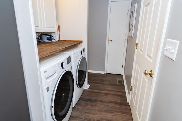 730 Maplecrest Dr, Troy, OH 45373 - washroom featuring washing machine and clothes dryer, dark wood finished floors, cabinet space, and baseboards