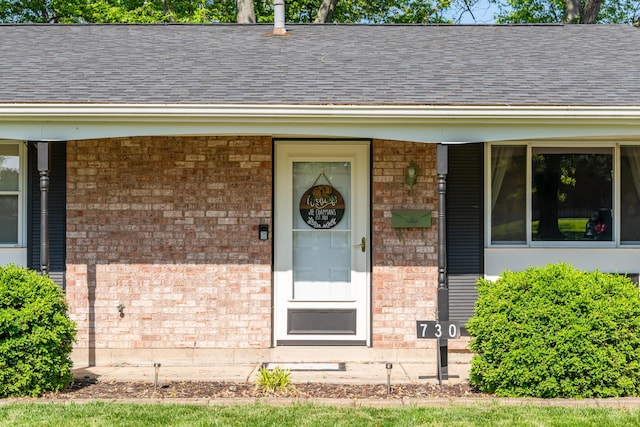 730 Maplecrest Dr, Troy, OH 45373 - entrance to property with brick siding, a shingled roof, and covered porch