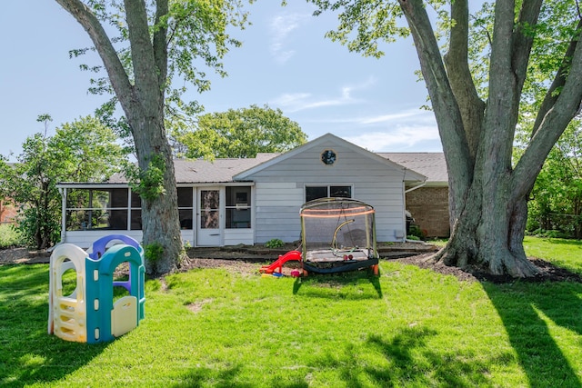 730 Maplecrest Dr, Troy, OH 45373 - rear view of property featuring a sunroom and a lawn