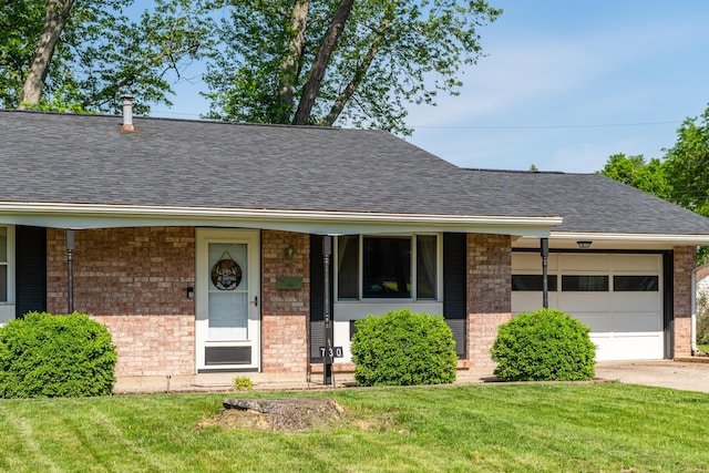 730 Maplecrest Dr, Troy, OH 45373 - view of front facade featuring brick siding, an attached garage, a shingled roof, and a front yard