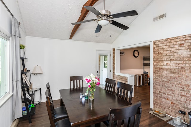 730 Maplecrest Dr, Troy, OH 45373 - dining room with healthy amount of natural light, dark wood-style floors, brick wall, a ceiling fan, and lofted ceiling