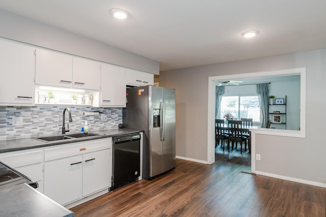 730 Maplecrest Dr, Troy, OH 45373 - kitchen with black appliances, a sink, backsplash, dark wood-style floors, and white cabinetry