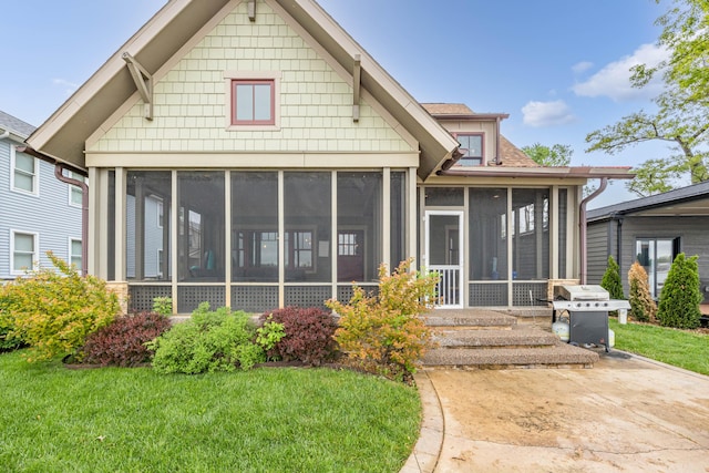 7933 Hickory Ave, Russells Point, OH 43348 - back of property with a sunroom and a yard