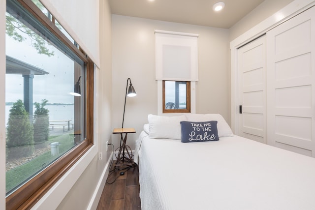 7933 Hickory Ave, Russells Point, OH 43348 - bedroom featuring dark wood-style flooring, recessed lighting, baseboards, and a closet