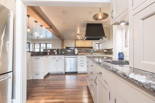 7933 Hickory Ave, Russells Point, OH 43348 - kitchen featuring stainless steel appliances, exhaust hood, tasteful backsplash, white cabinets, and dark wood finished floors