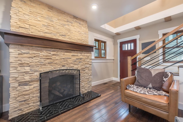 7933 Hickory Ave, Russells Point, OH 43348 - living room featuring baseboards, wood finished floors, stairs, a fireplace, and recessed lighting