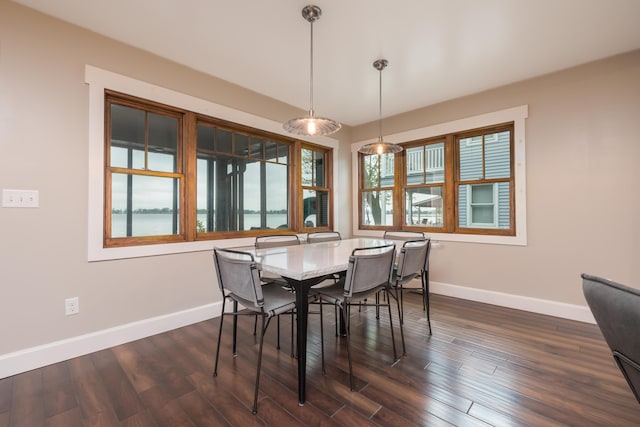 7933 Hickory Ave, Russells Point, OH 43348 - dining area featuring baseboards and dark wood finished floors