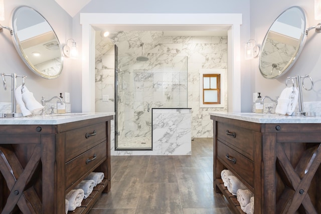 7933 Hickory Ave, Russells Point, OH 43348 - bathroom featuring walk in shower, two vanities, and wood finished floors