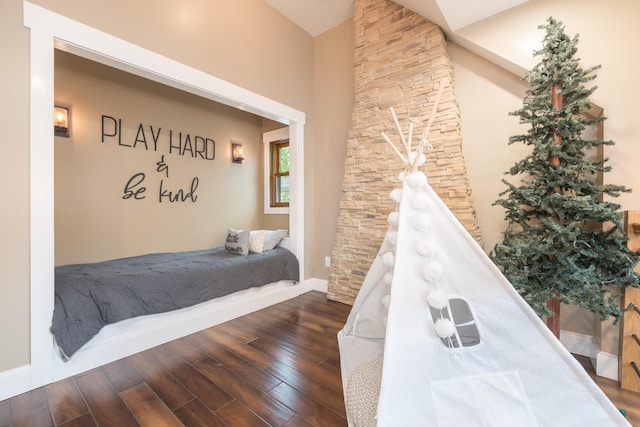 7933 Hickory Ave, Russells Point, OH 43348 - bedroom featuring wood finished floors, baseboards, and high vaulted ceiling