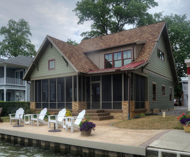 7933 Hickory Ave, Russells Point, OH 43348 - rear view of house with a sunroom and a shingled roof