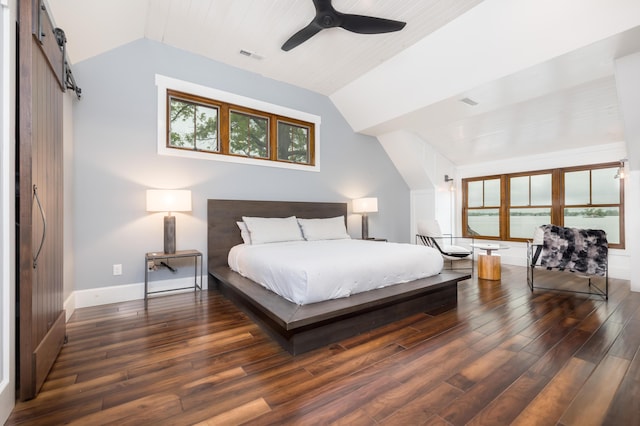 7933 Hickory Ave, Russells Point, OH 43348 - bedroom with lofted ceiling, wood finished floors, baseboards, and a barn door