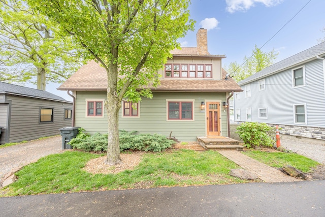7933 Hickory Ave, Russells Point, OH 43348 - view of front of house featuring a chimney and roof with shingles