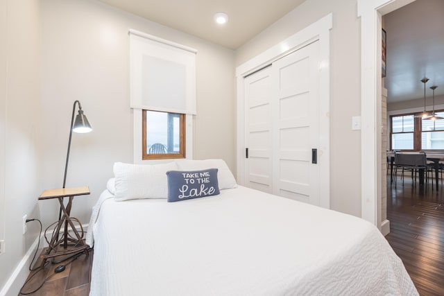 7933 Hickory Ave, Russells Point, OH 43348 - bedroom with dark wood-type flooring, baseboards, recessed lighting, and a closet