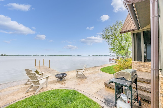 7933 Hickory Ave, Russells Point, OH 43348 - dock with an outdoor fire pit, a patio area, and a water view