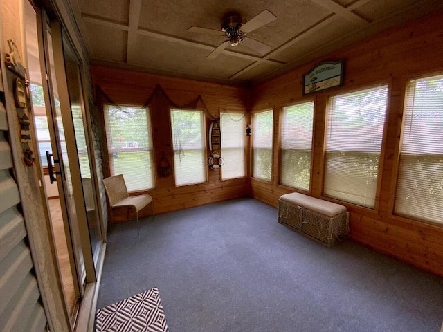 224 Oakcrest Ct, Russells Point, OH 43348 - unfurnished sunroom featuring wooden walls and carpet floors