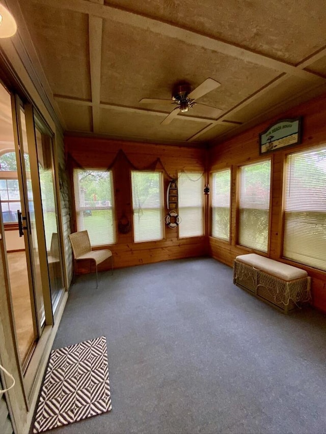 224 Oakcrest Ct, Russells Point, OH 43348 - unfurnished sunroom with carpet floors, plenty of natural light, wooden walls, and coffered ceiling
