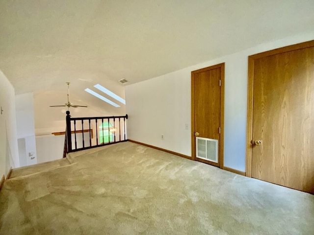 224 Oakcrest Ct, Russells Point, OH 43348 - additional living space featuring carpet, ceiling fan, a skylight, vaulted ceiling, and baseboards