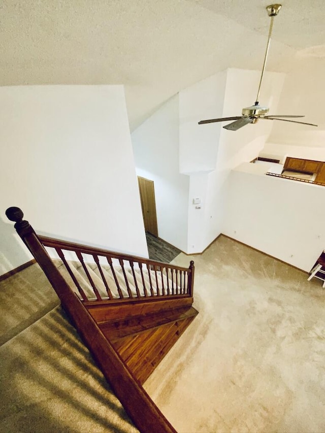 224 Oakcrest Ct, Russells Point, OH 43348 - staircase featuring carpet flooring and ceiling fan