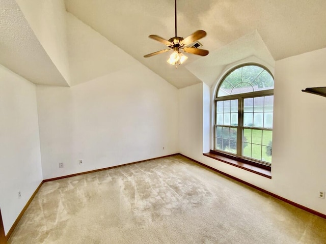 224 Oakcrest Ct, Russells Point, OH 43348 - carpeted spare room with vaulted ceiling, a ceiling fan, and baseboards