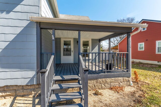 property entrance with covered porch