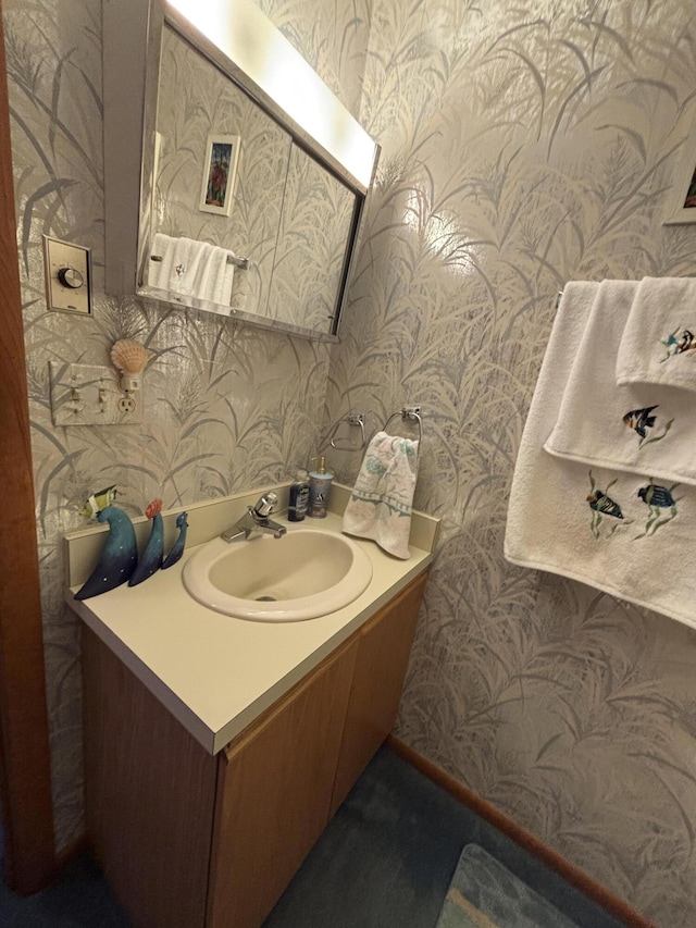 129 Chase Ave Unit 11U, Russells Point, OH 43348 - bathroom featuring wallpapered walls and vanity